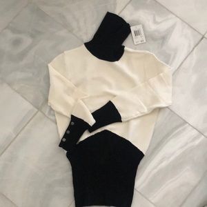 Dramatic black and white sweater